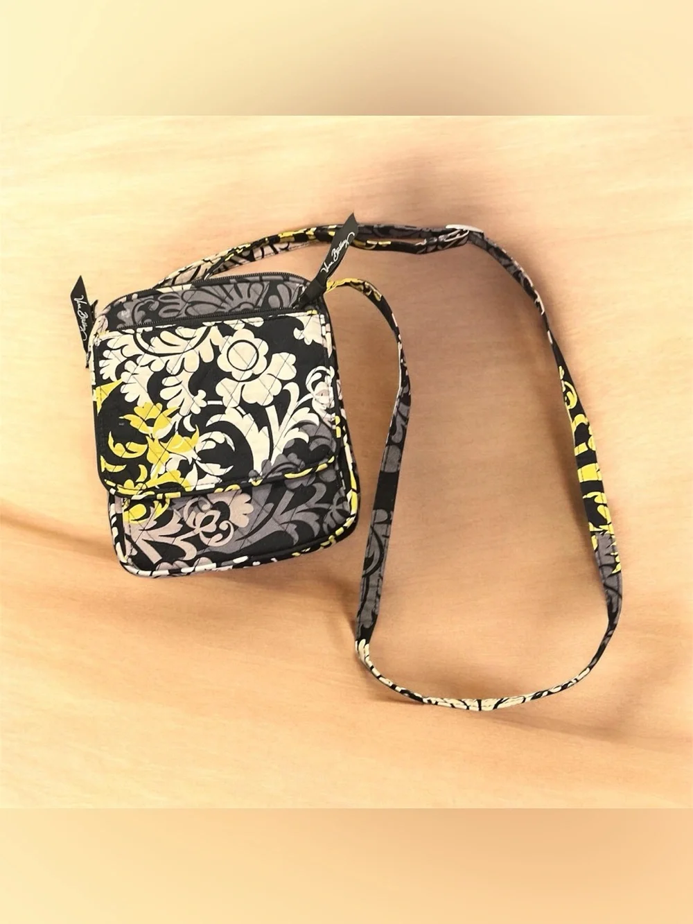 Vera Bradley Mini Hipster Floral Crossbody Bag in Black in “Baroque” pattern.